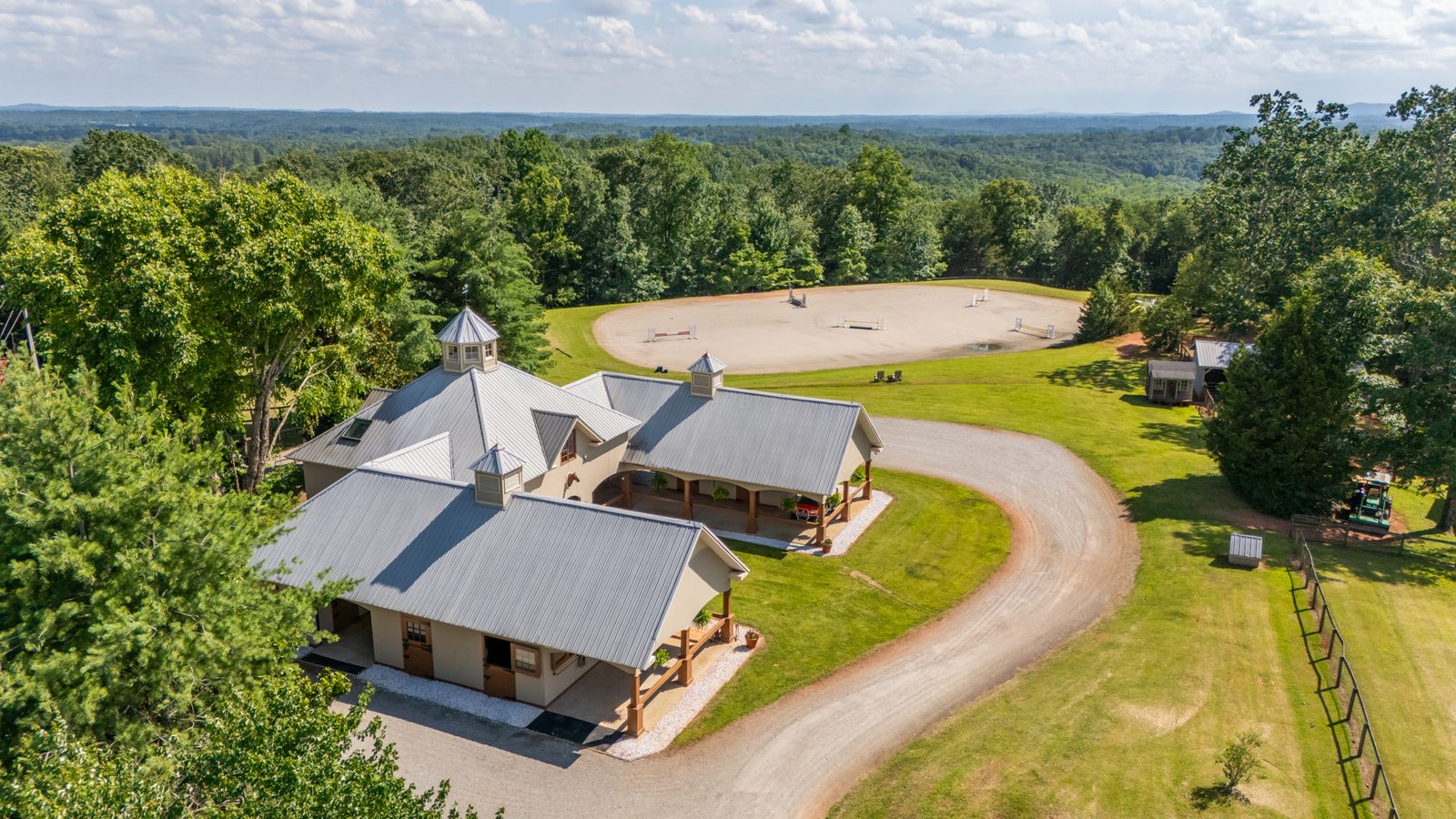 Wellington-style barn and jump ring at Hidden Hollow Farm, Columbus NC
